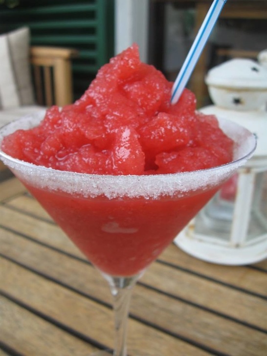 close up of a strawberry mojito in a glass