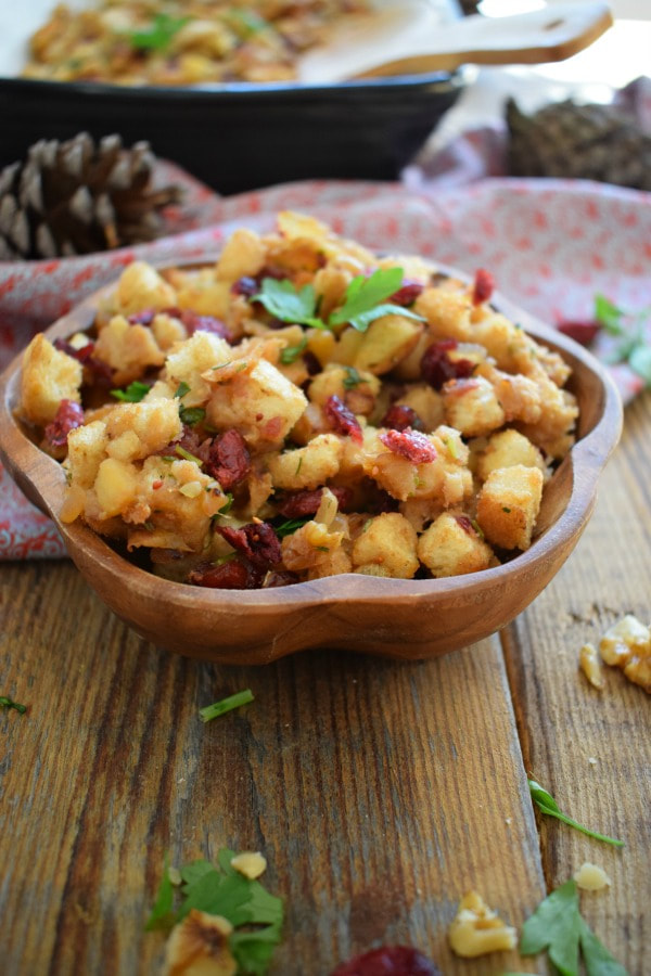 cranberry and apple stuffing in a wooden bowl