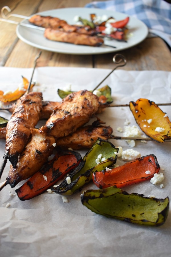 Close up of the Teriyaki Chicken Skewers with a charred pepper salad