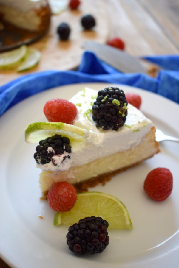 a slice of Berry Topped Lime Cheesecake
