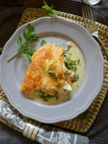 chicken and vegetable pie on a grey plate