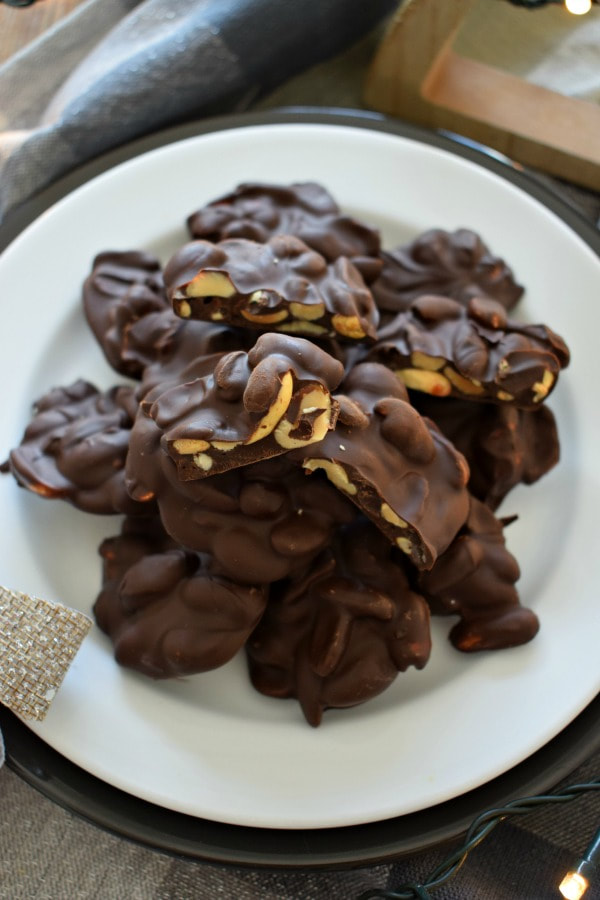 over head view of the chocolate peanut clusters on a white plate