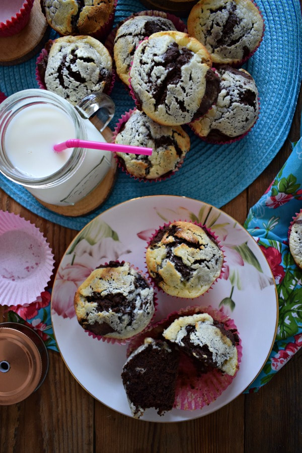 Table setting of the Chocolate Cream Cheese Muffins with a glass of milk