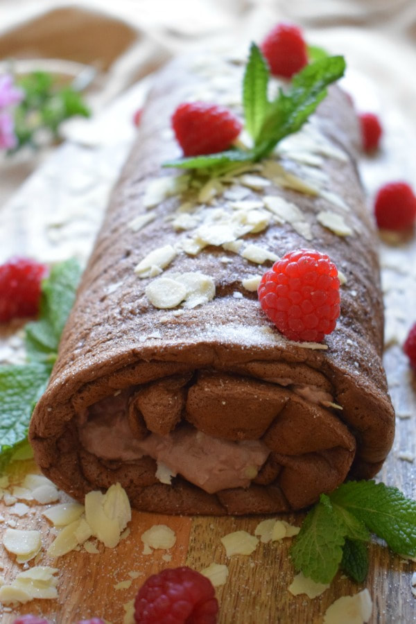 Chocolate Raspberry Roulade on a wooden board