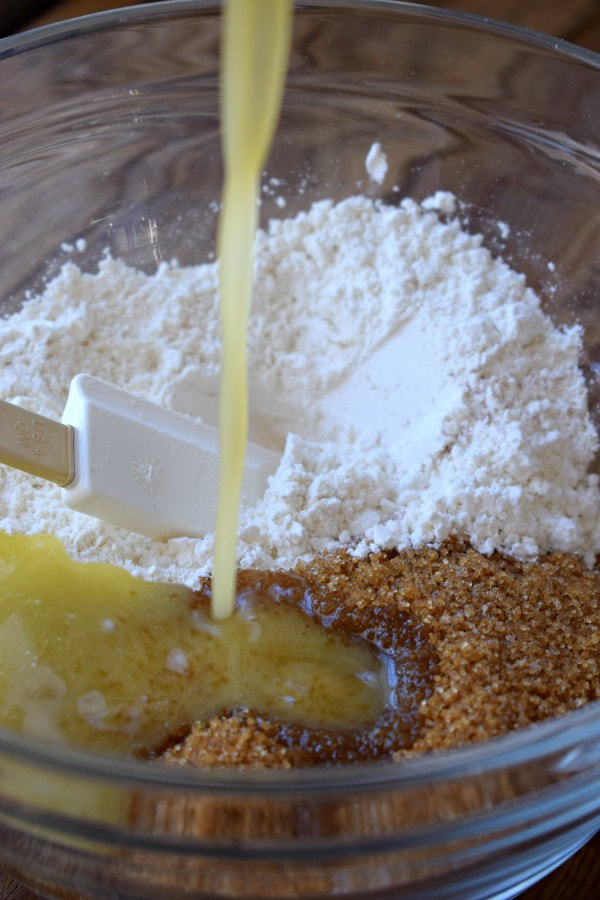 Making a cookie base for coconut bars.