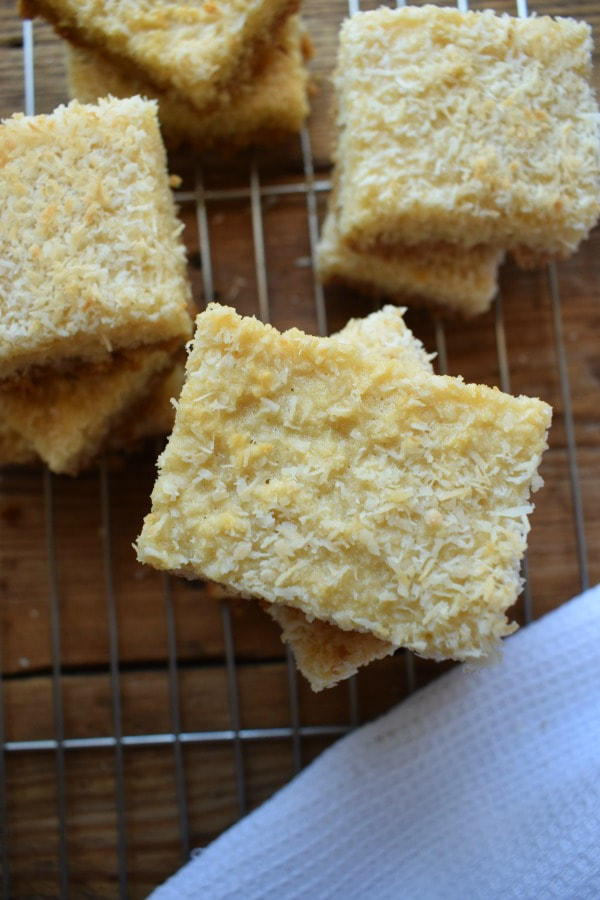 Coconut bar cookies on a cooling rack.