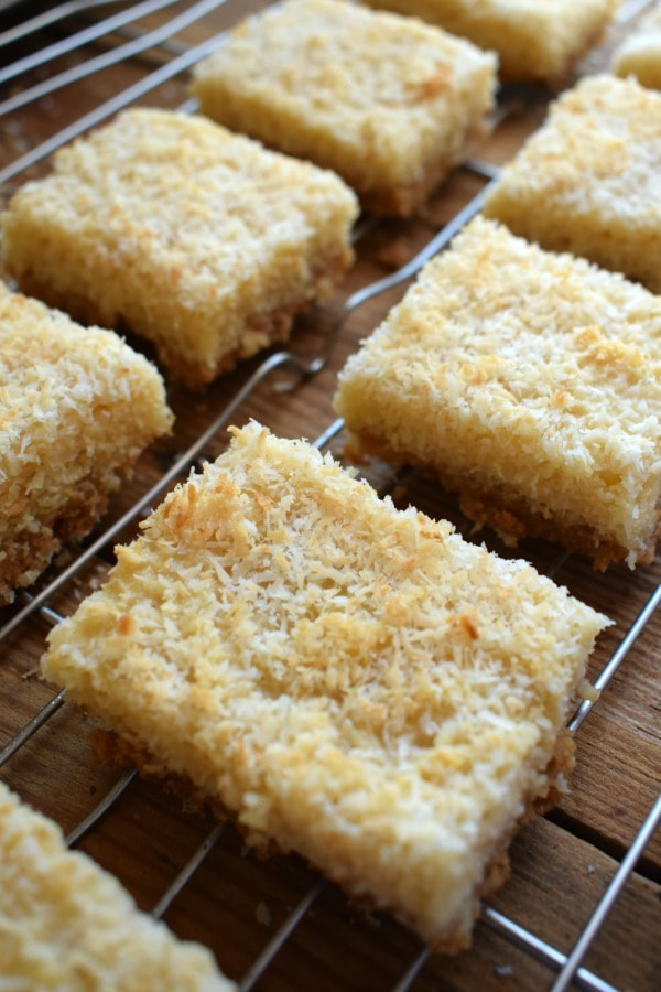 Coconut bars on a cooling rack.