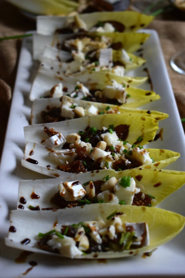 Fig & Goat Cheese Endive Cups on a serving platter