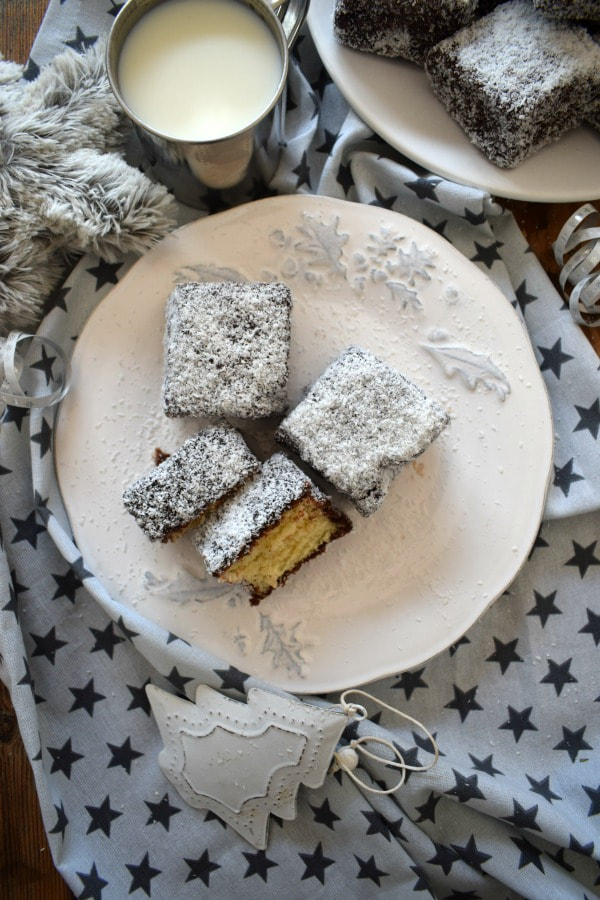 chocolate coconut squares on a Christmas plate