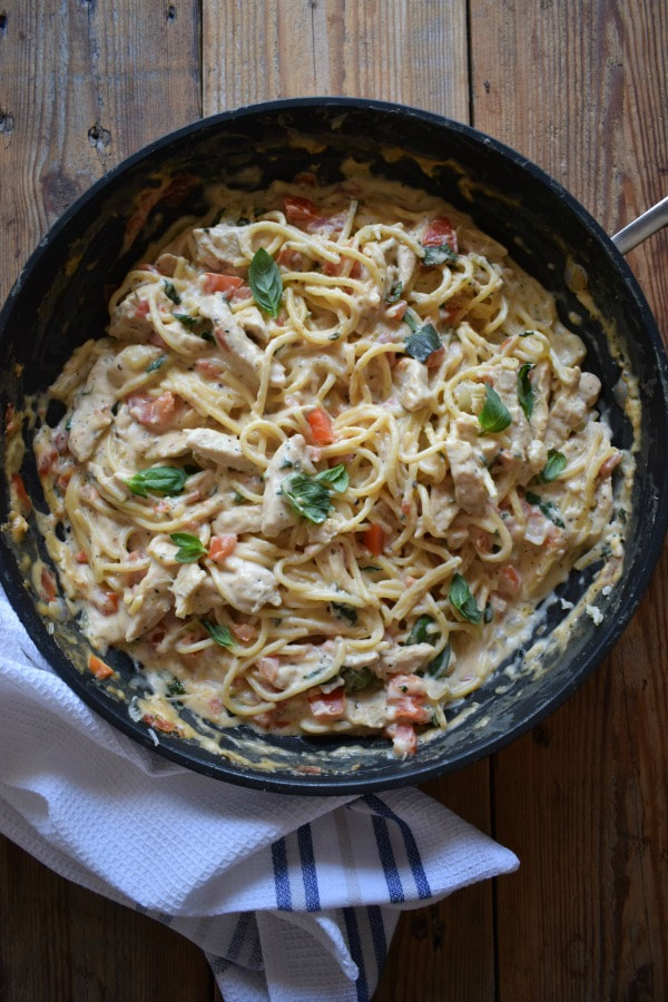 creamy chicken pasta in a skillet