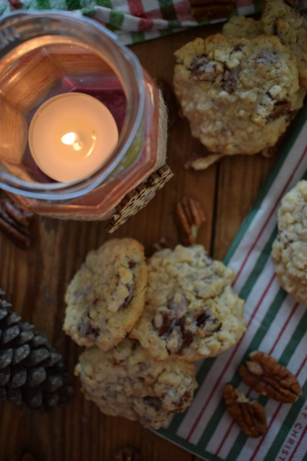 Overhead view  of the pecan oatmeal cookies iwth a candle