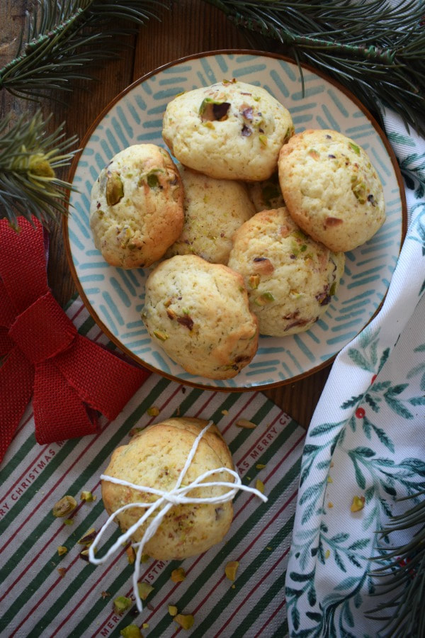 Mascarpone Pistachio cookies on a pretty plate with Christmas decor