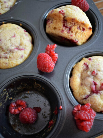 raspberry muffins in a tray.