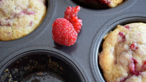 raspberry muffins in a tray.