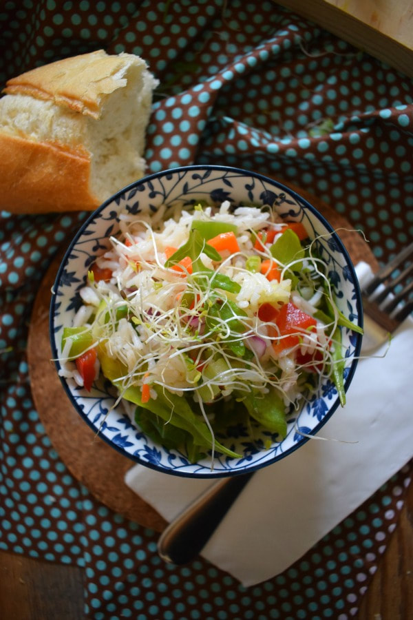  Vegetable Rice Salad  with bread and a napkin