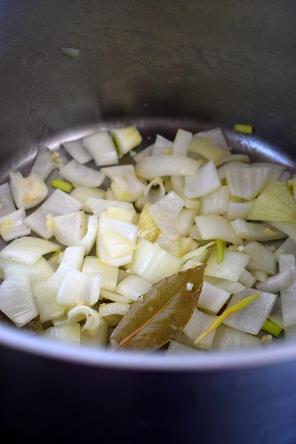 COOKING ONIONS IN A POT FOR VEGETABLE SOUP