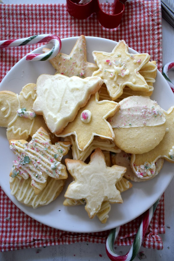 over head view of the butter cream topped sugar cookies with candy canes