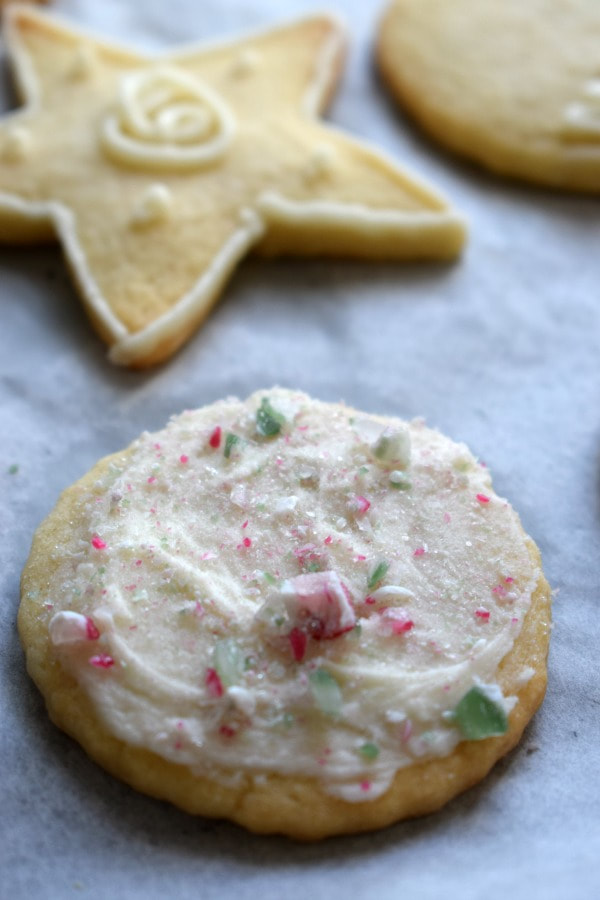 close up view of a butter cream topped sugar cookies