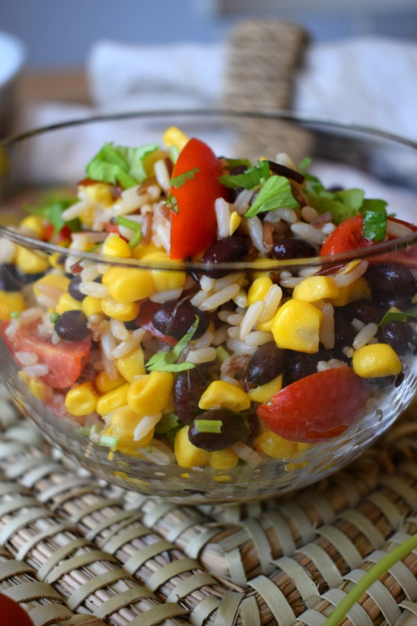 close up of the wild rice and black bean salad in a glass bowl