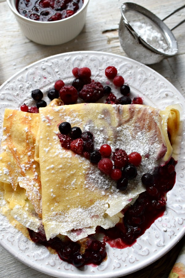 Wild Berry Compote Filled Crepes on a plate