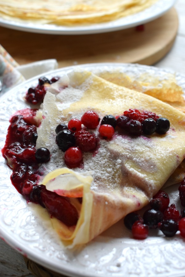 close up of the wild berry compote filled crepes
