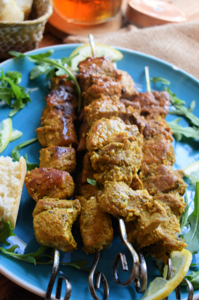 Close up of Moroccan Spiced Pork Kebabs on a plate