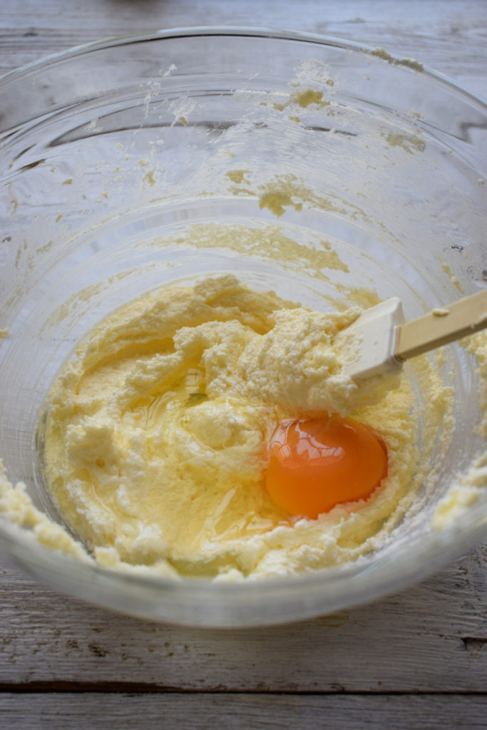 Add eggs and vanilla extract to sugar and butter.