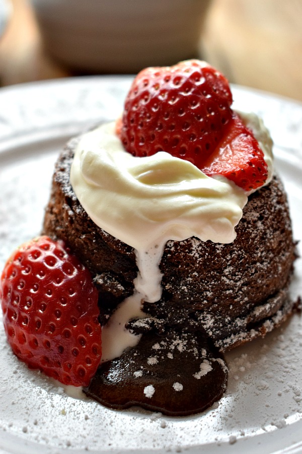 Molten Chocolate Lava Cakes with strawberries and cream image