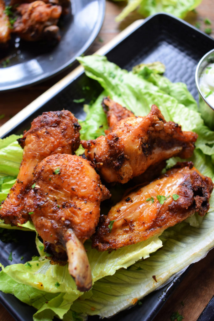 Oven baked wings on a bed of lettuce