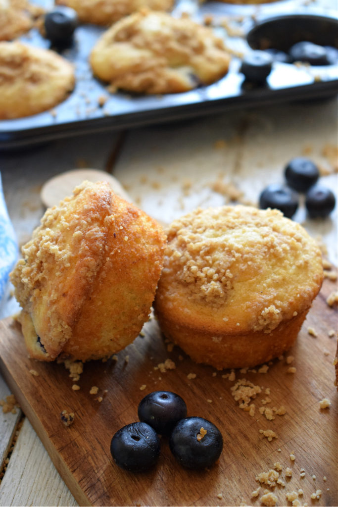 blueberry struden muffins on a wooden tray