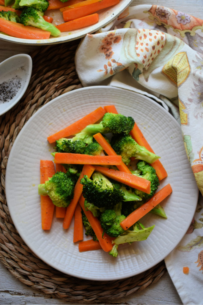 Table setting of the butter sauteed broccoli & carrots