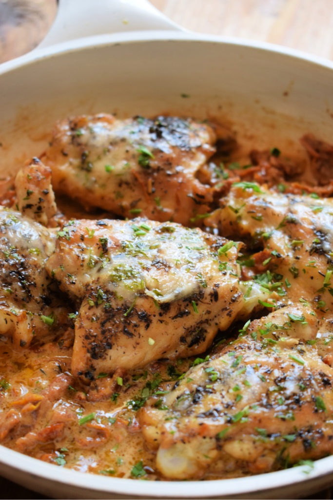 Close up of the skillet chicken in a creamy sun dried tomato sauce