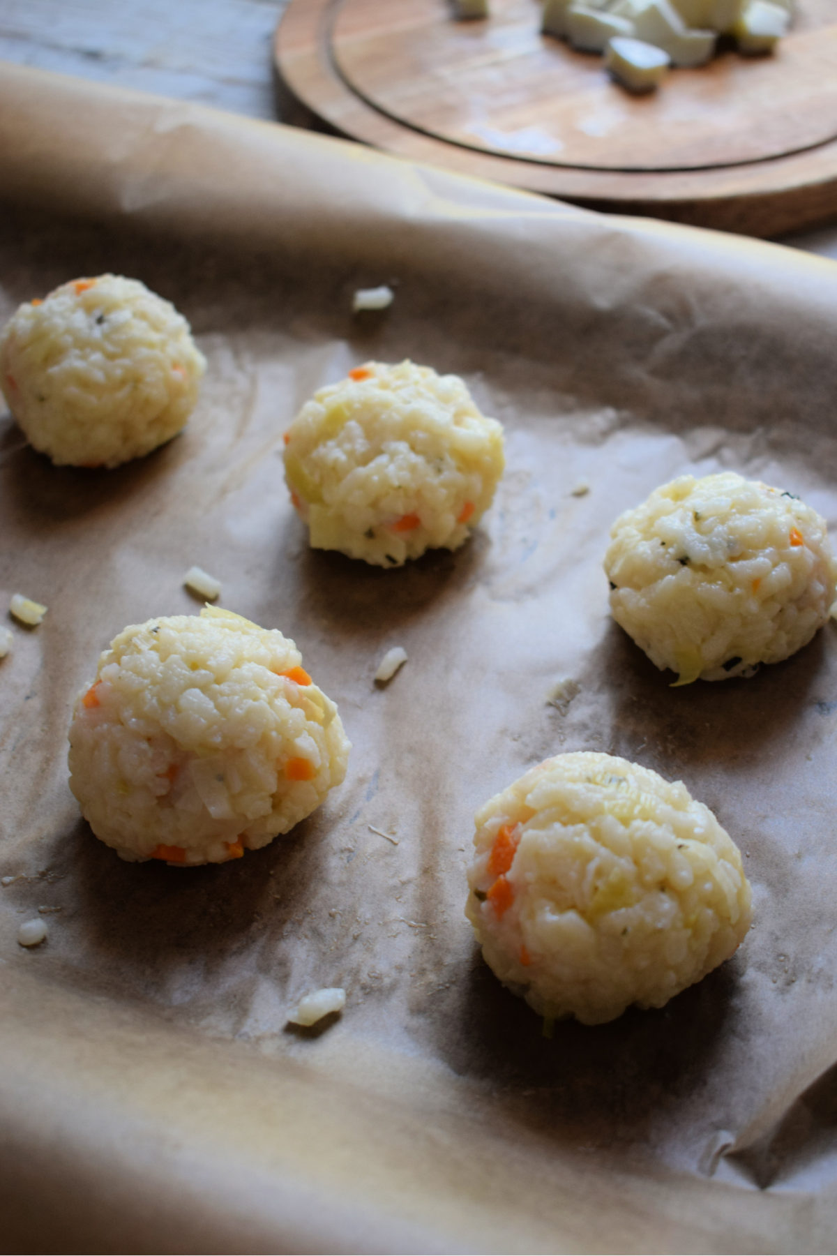 arancini balls on a plate ready to fry