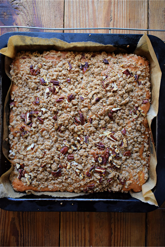 Over head view of the pecan strudel snacking cake in a baking tin