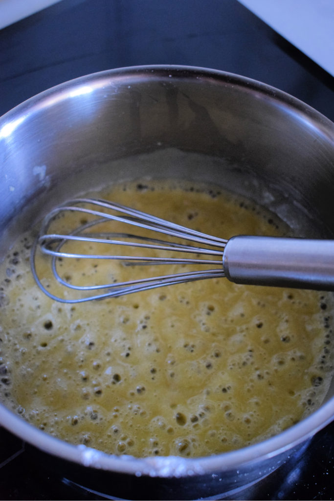 Cooking butter and flour in a saucepan.