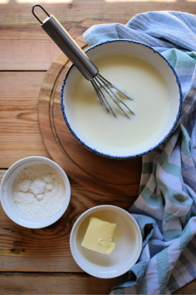 Roux sauce in a bowl with butter and flour on the side