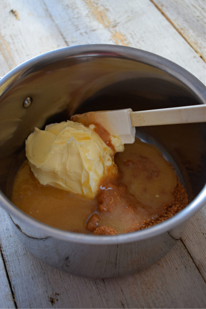 Combining butter, sugar and syrup in a saucepan.