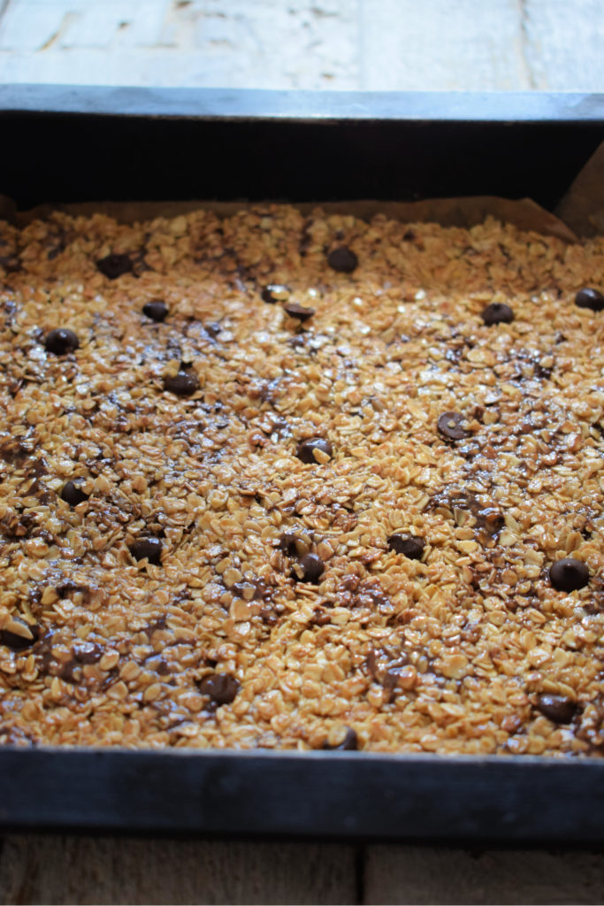 Chocolate chip flapjacks in a baking tray