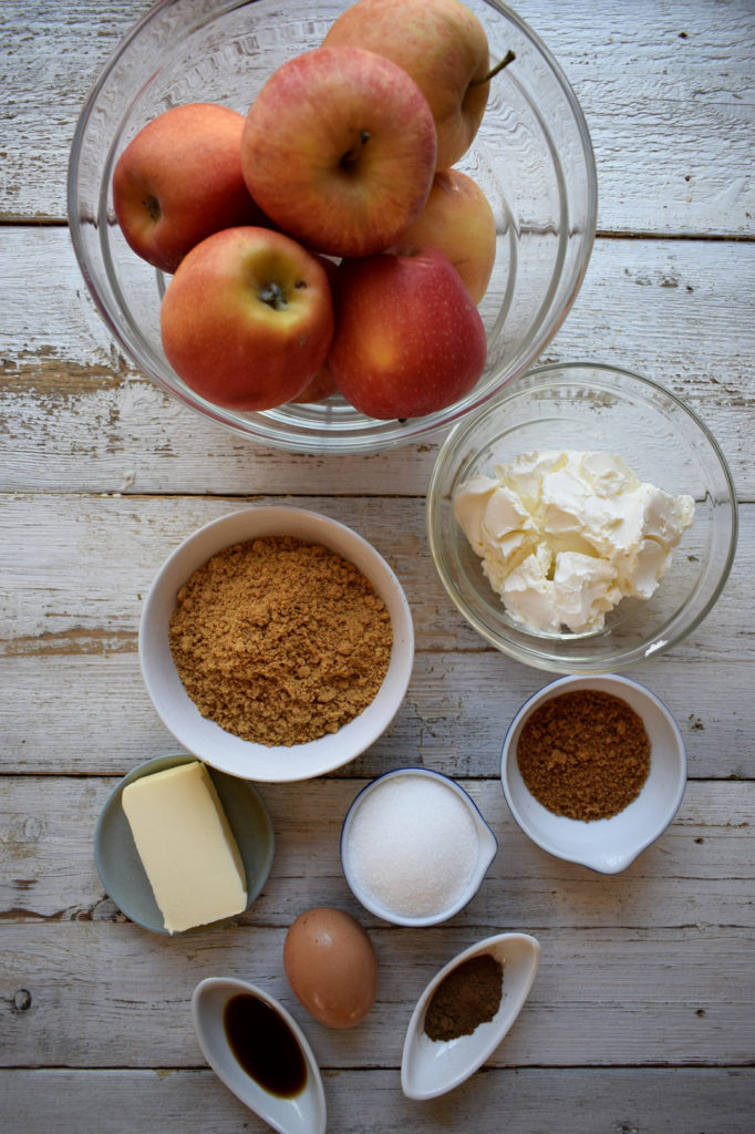 INGREDIENTS IN BOWLS TO MAKE CHEESECAKES
