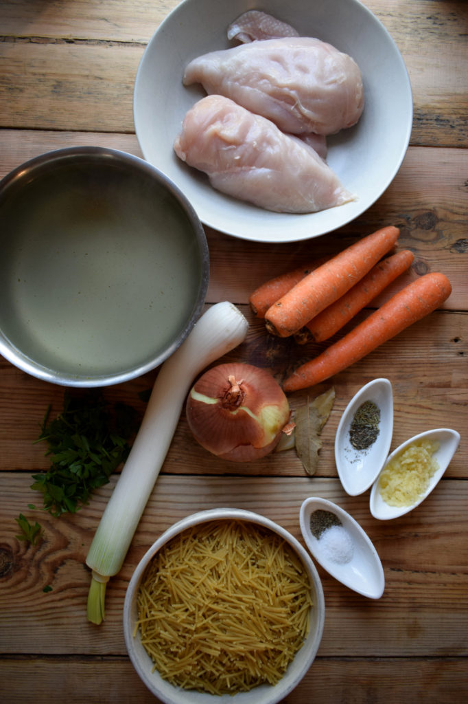 over head view of the ingredients to make the slow cooker chicken noodle soup