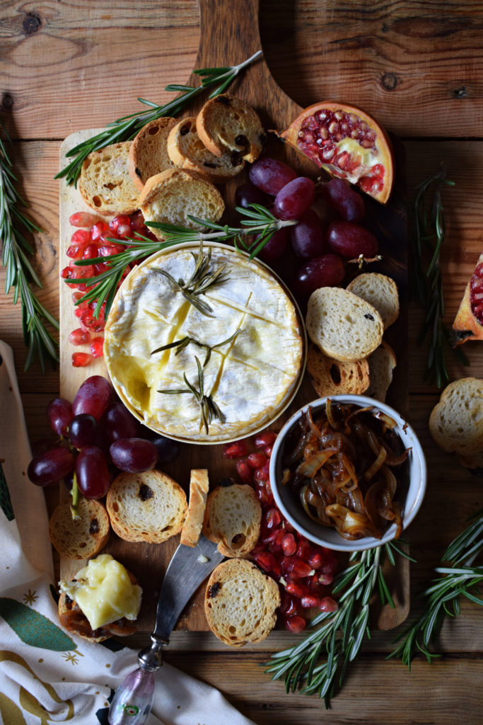 over head view of the baked camembert with rosemary