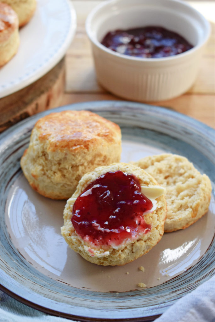 Light and fluffy scones on a plate with jam