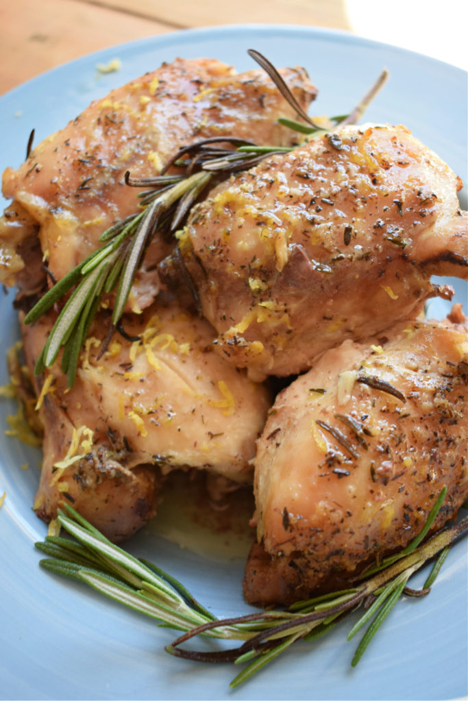  lemon and rosemary chicken in a blue serving dish