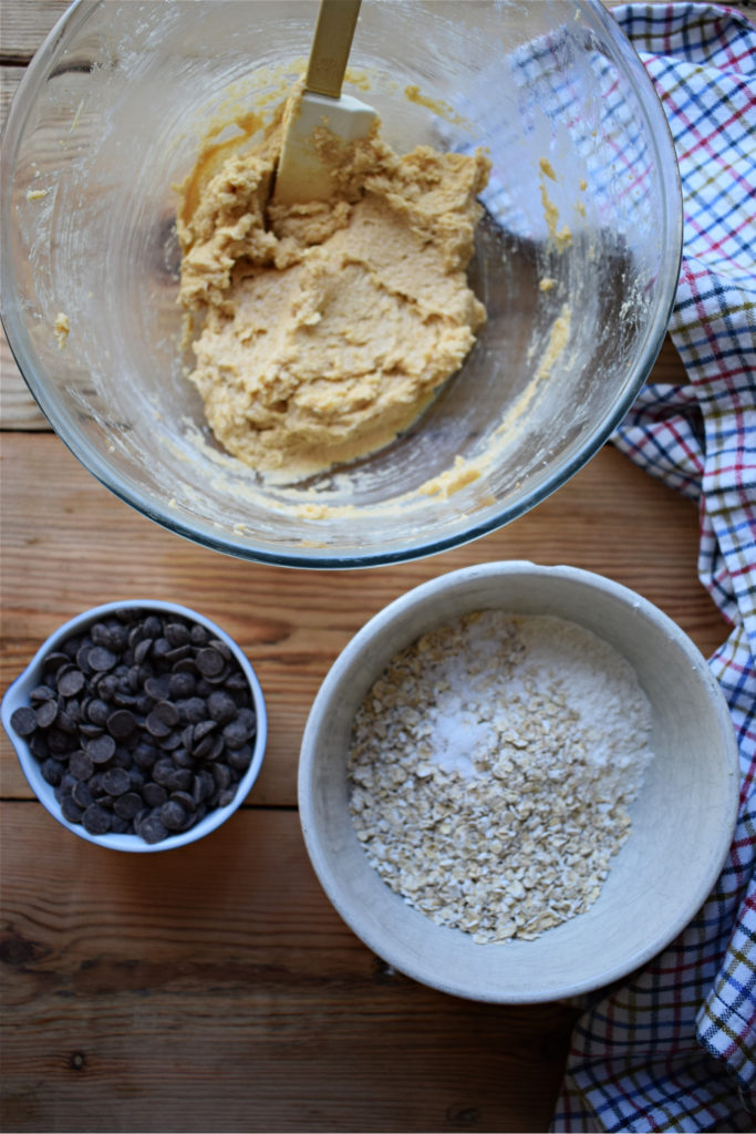 ingredients to make the chocoalte chip oatmeal cookies in bowls