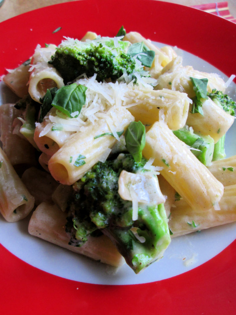 Creamy Broccoli & Penne Pasta  in a red bowl