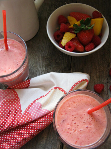 Mango and berry smoothie with berries in a bowl