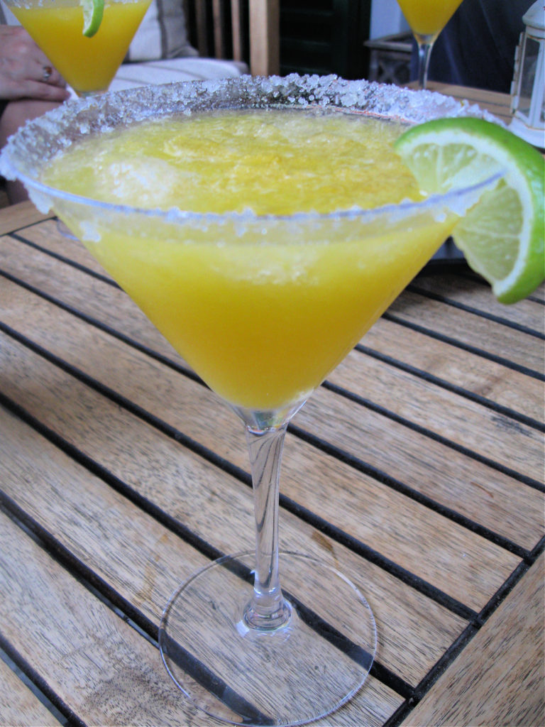 a mango margarita in a cocktail glass