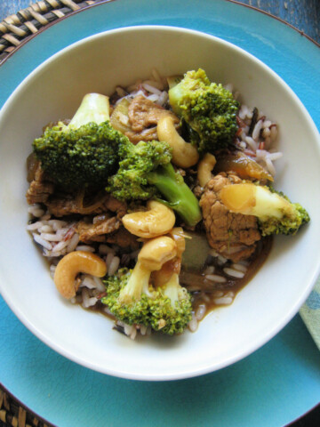 the Pork and broccoli stir fry in an orange sauce in a bowl