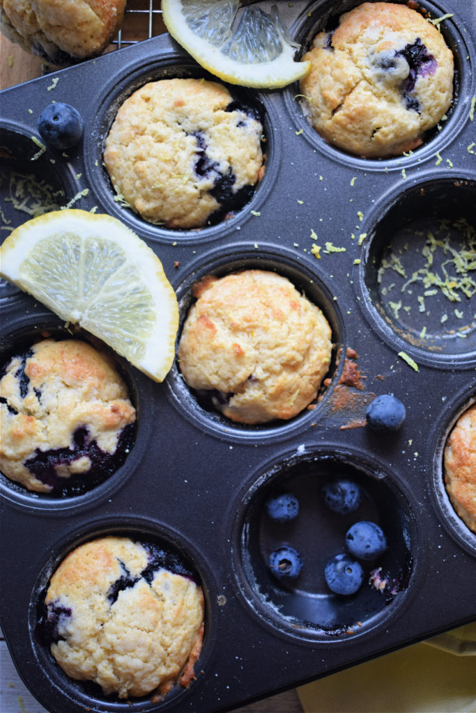 blueberry lemon muffins in a baking tray