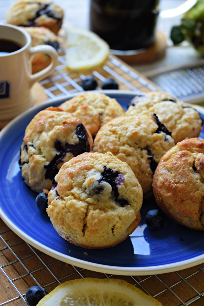 blueberry lemon muffins on a blue plate